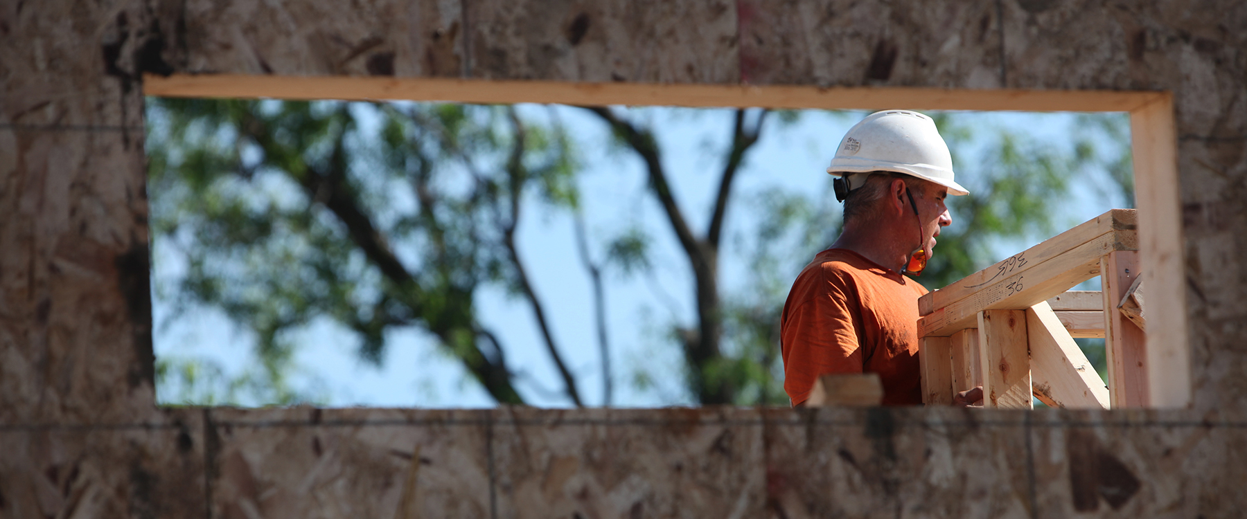 Construction volunteer through window