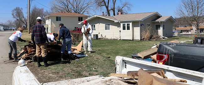 Disaster response volunteers from Habitat Omaha and Team Rubicon
