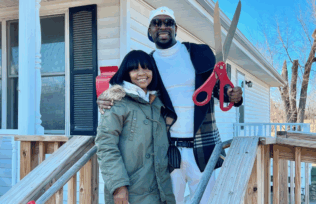 Fontroy, right and his partner, outside his mother’s former home that now belongs to him.